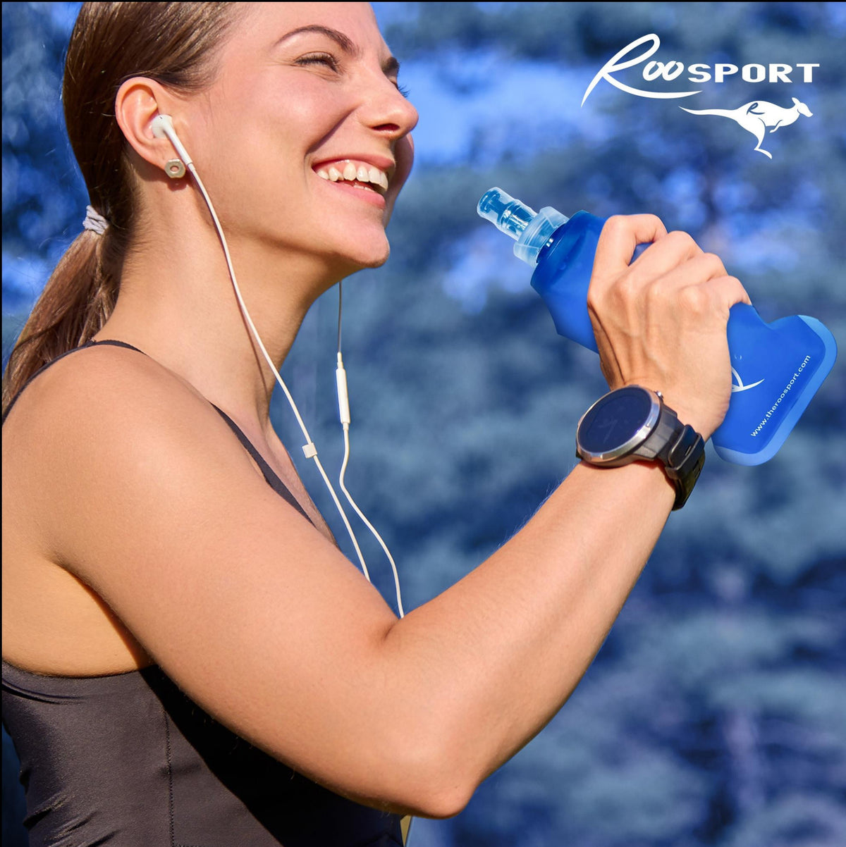 Woman drinking from a collapsible running water bottle