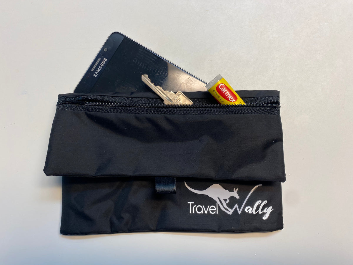 Travel Wally holding keys, lip balm and a phone
